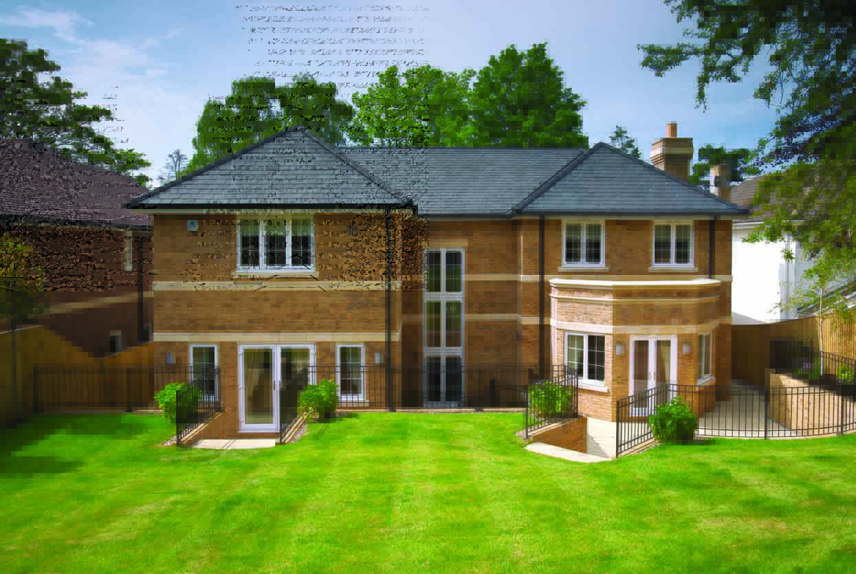 large brick house with grey tiled roof, white framed windows and landscape lawn