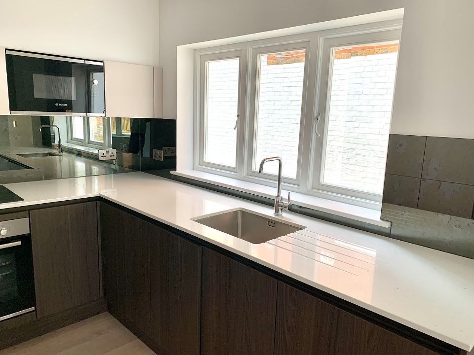white framed casement window installed in kitchen