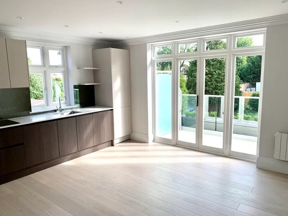 large white framed french doors installed in the kitchen