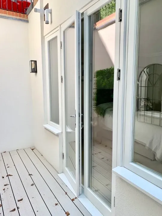 large white framed timber french doors