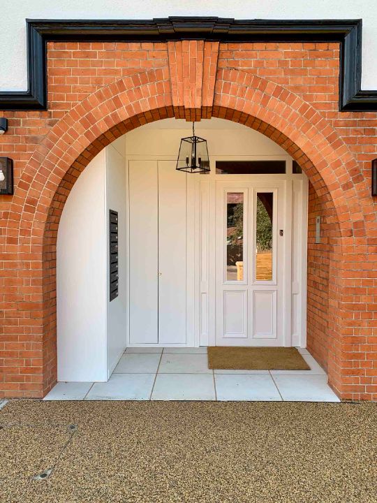 white framed timber front doors